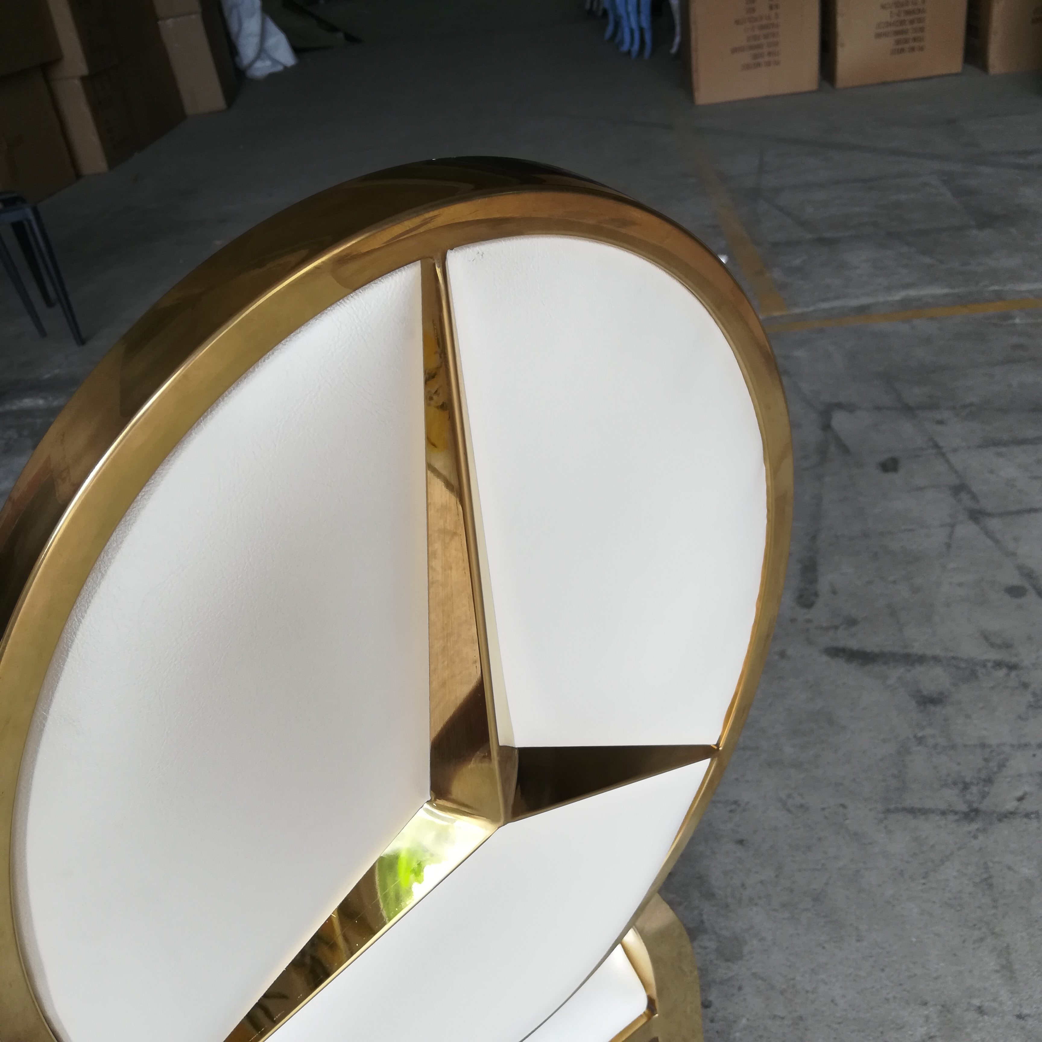 White and gold logo dining chair - luxurious oval-back upholstered chair