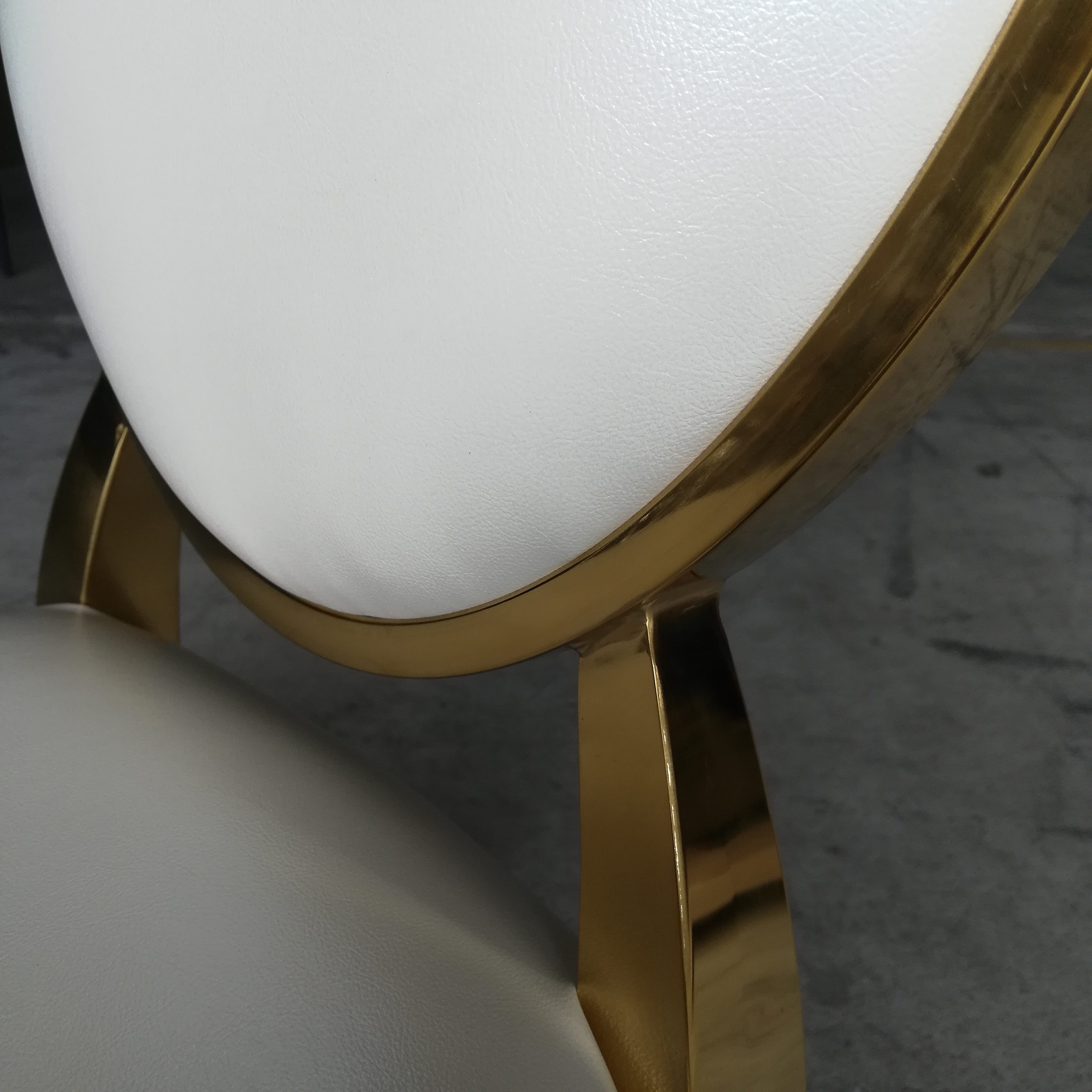 White and gold logo dining chair - luxurious oval-back upholstered chair